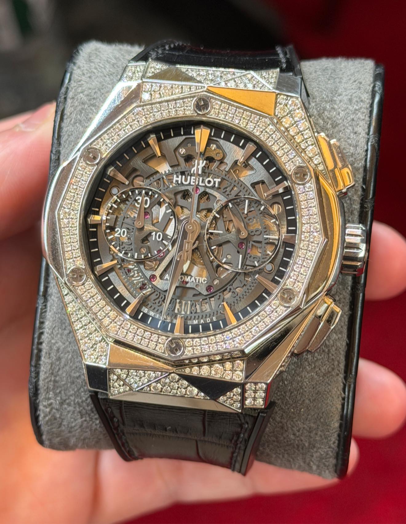 May be an image of wrist watch and text
