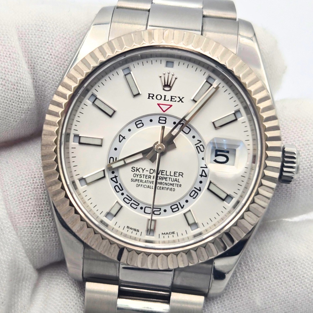 May be an image of wrist watch and text that says 'יויוין W ROLEX 6 8 4 O i 12 5 OYSTERF GETER RPETUAL SKY-DWELLER SKY-DI /ELLER SUPERLATIVE OFFICIALL SUPERLATIVE HRONOMET…