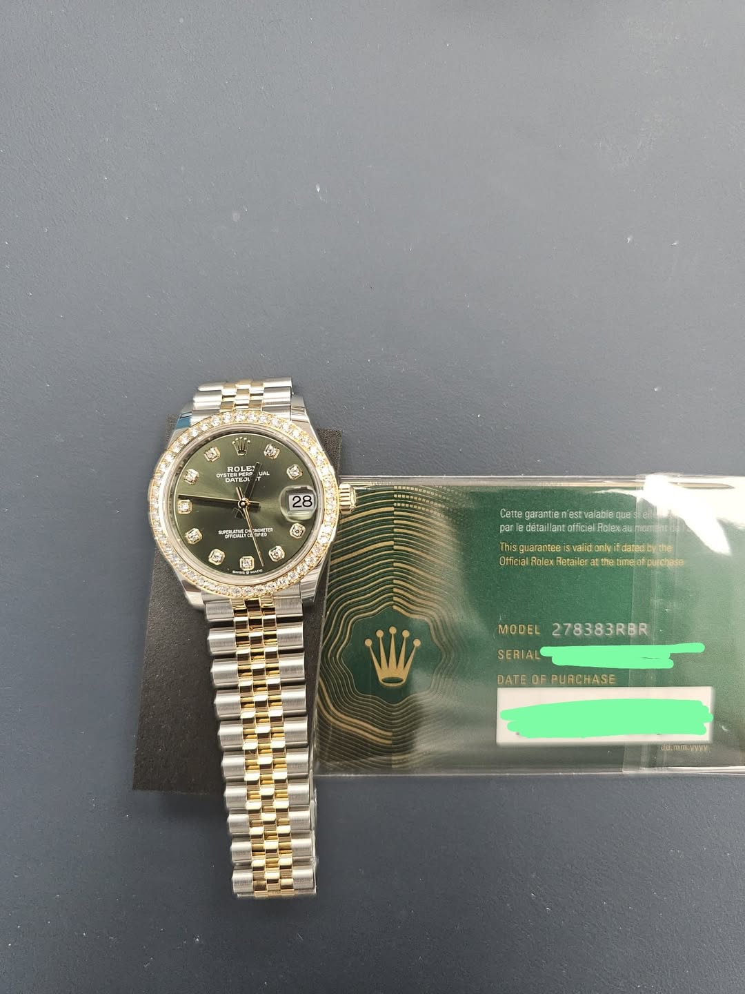 May be an image of wrist watch and text