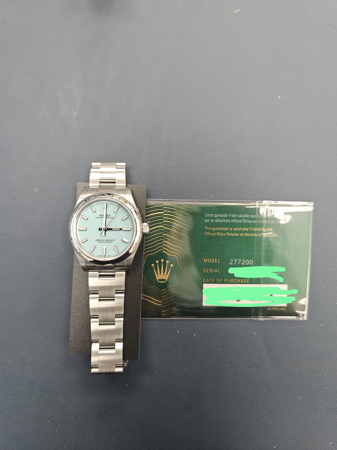 May be an image of wrist watch, ticket stub and text