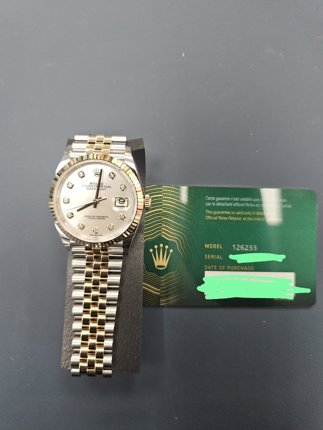 May be an image of wrist watch and text