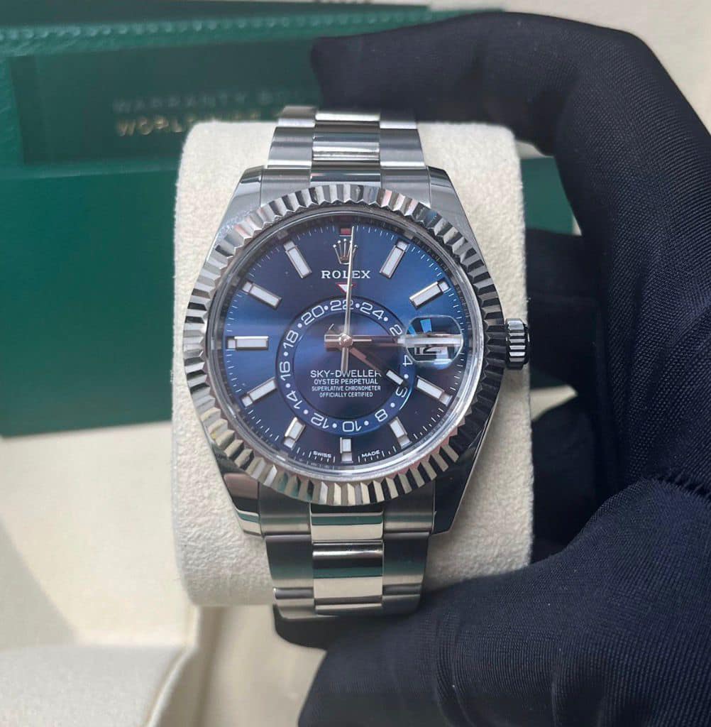 May be an image of wrist watch and text