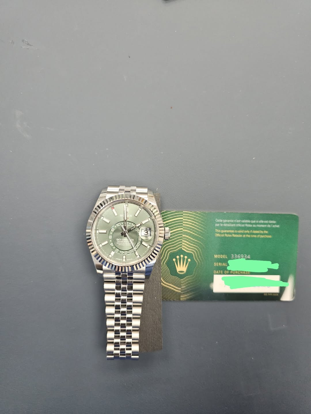 May be an image of wrist watch and text