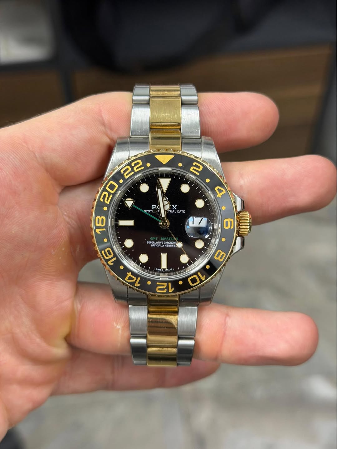 May be an image of wrist watch and text