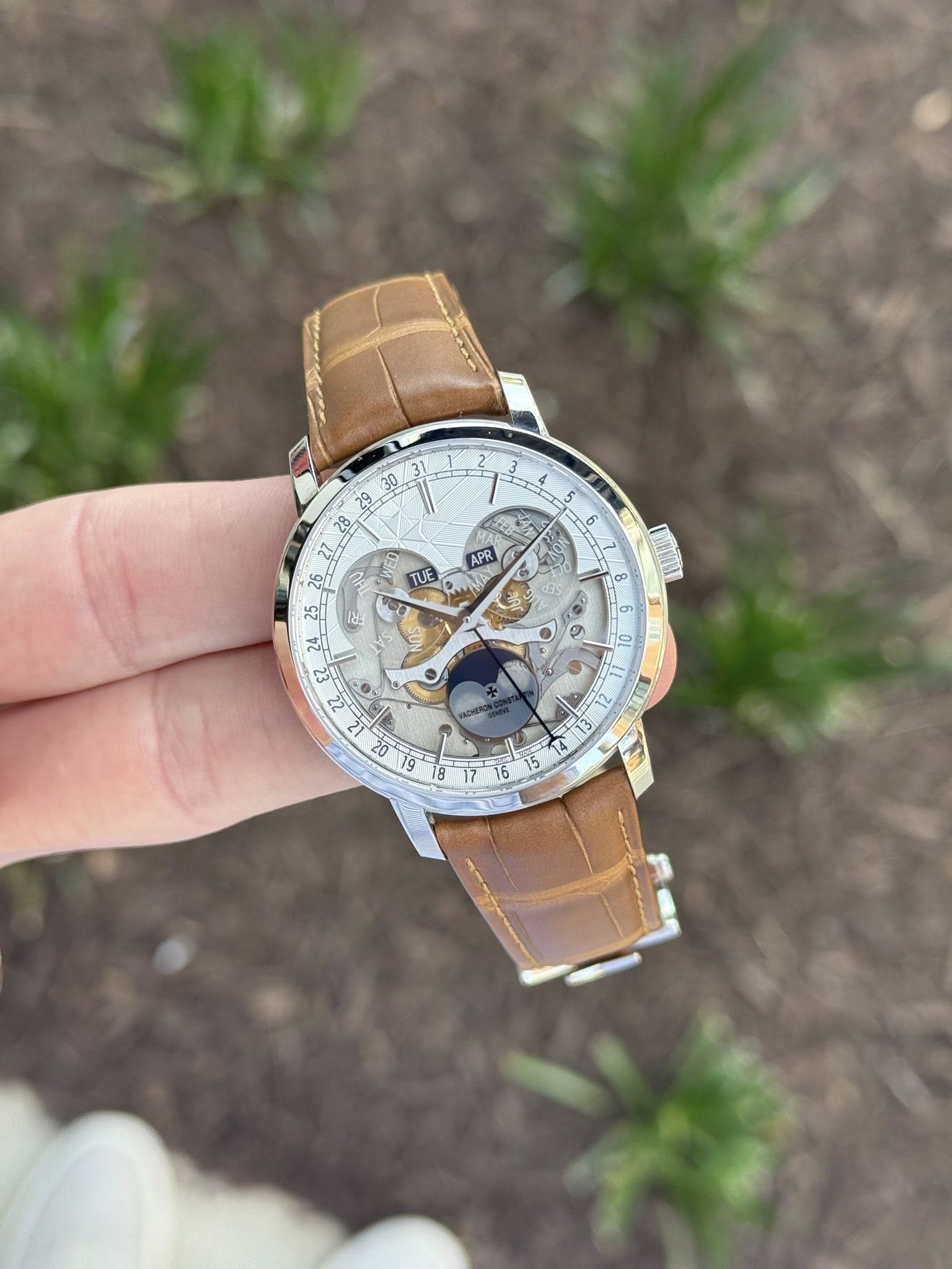 May be an image of wrist watch and text that says ' _28 26 b APR TUE d '