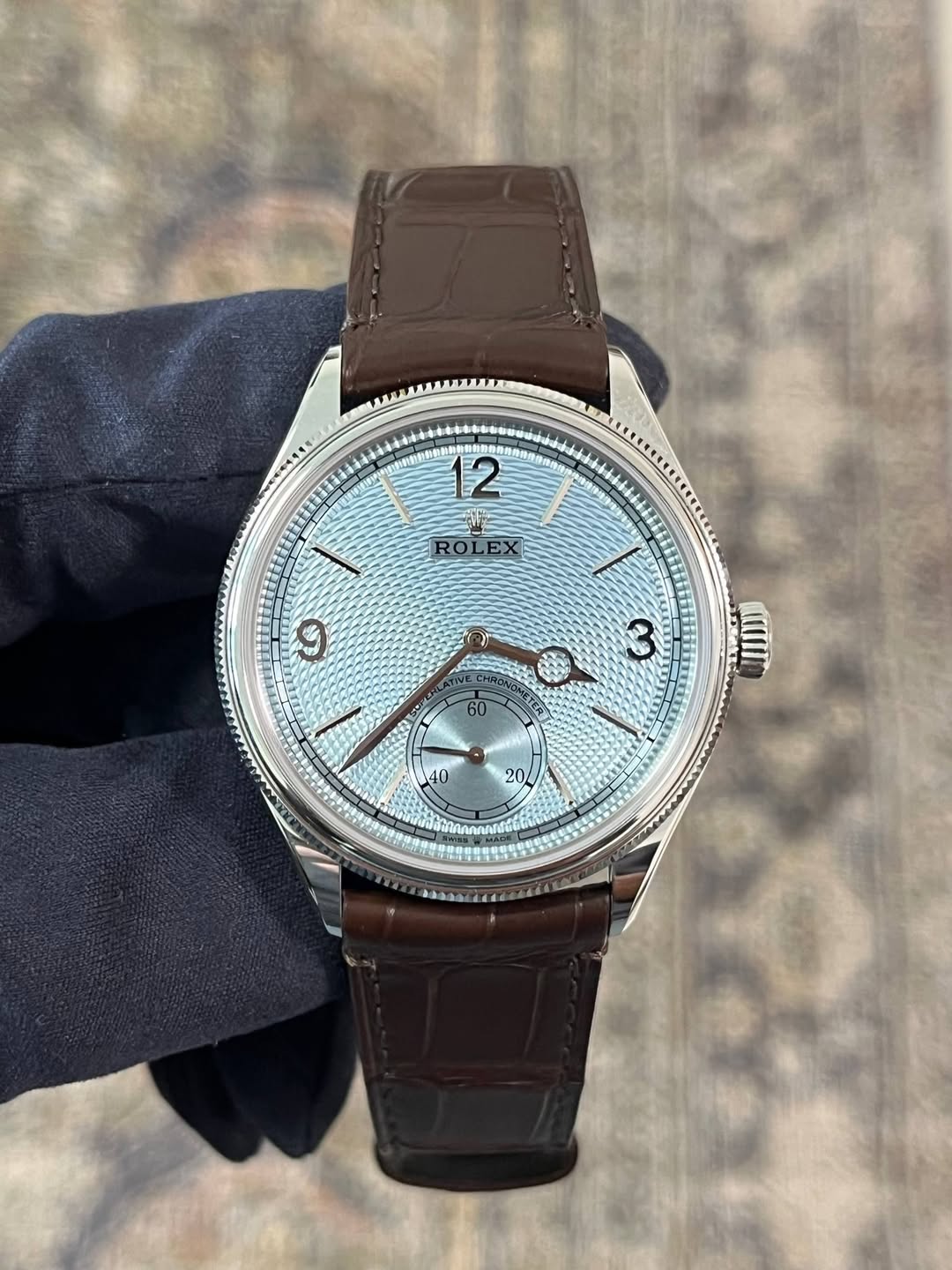 May be an image of wrist watch and text