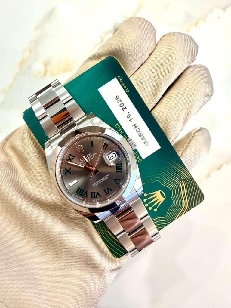 May be an image of wrist watch and text that says 'V ידץ በሞን mm. 3.00 0 de m 2026 19. MARCH 5 5T1 55I DOTUAL 20 ATA ION LICE O 9'