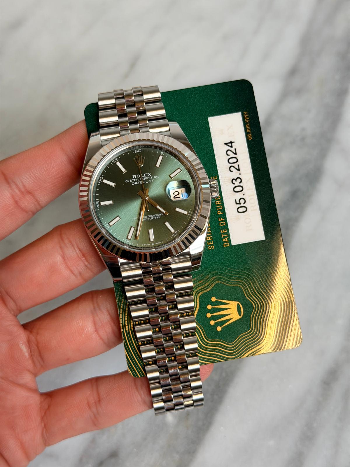 May be an image of wrist watch and text that says '60 Re RO RPETUA PrES OTS DA oAT JUST 45 21 ONATER 2024 女山 05 OF SERIA DATEOFPURCU UR PURU . TE RO DAT I Faaan'