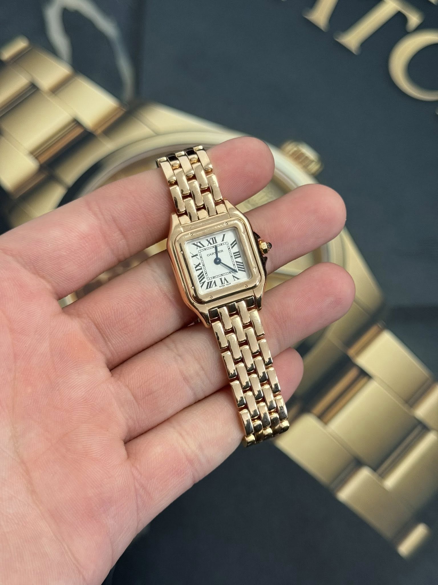May be an image of wrist watch and text that says 'XII 7 nA A'