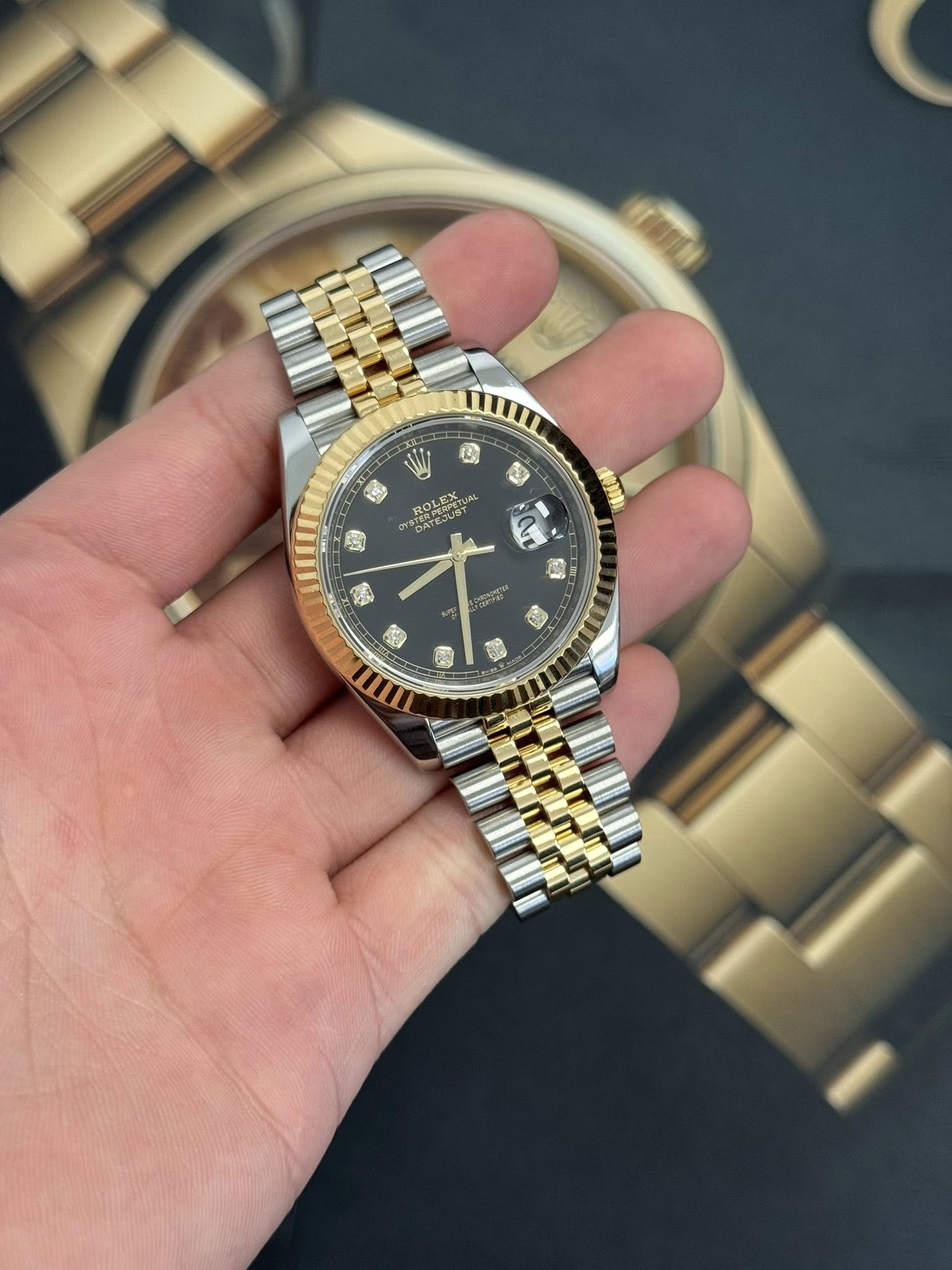 May be an image of wrist watch and text