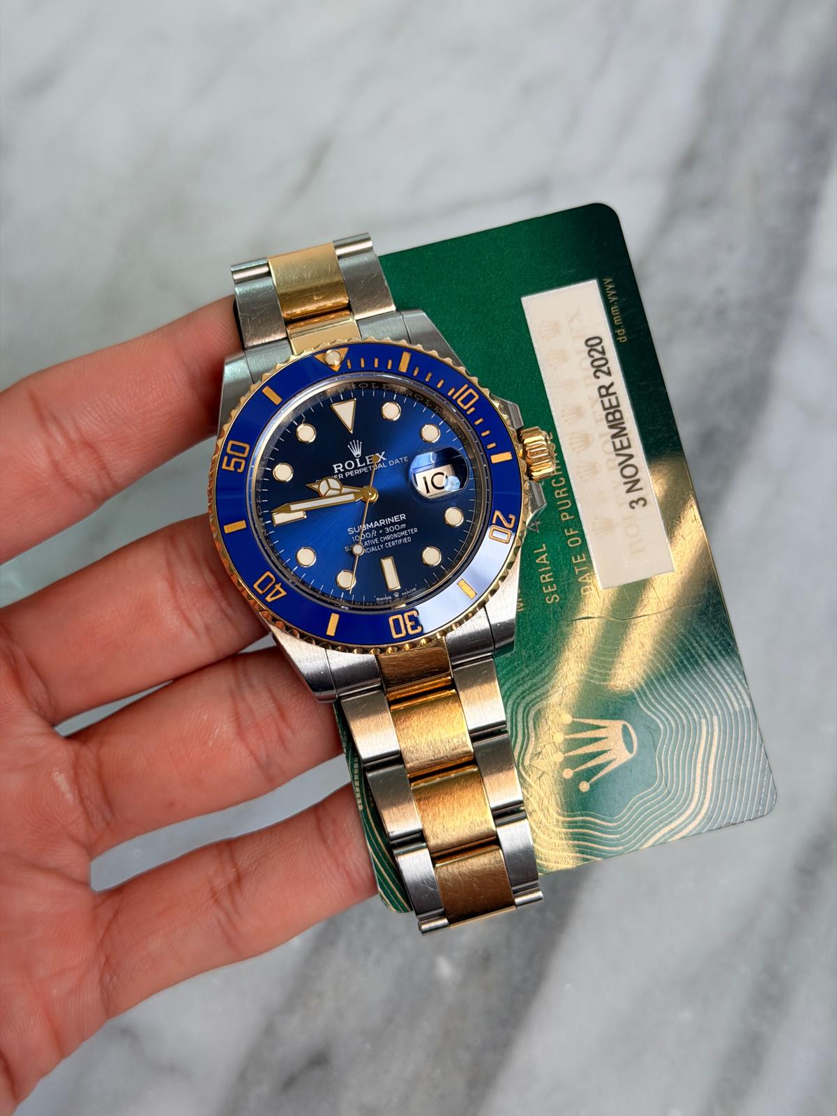 May be an image of wrist watch and text that says '50 50 ROL 10 UREMARINER ARINER 2020 D NOVEMBER PURC 3 20 WLOA OF SERIAL DATE ATEOFPURCANE AT TE 40 σE'