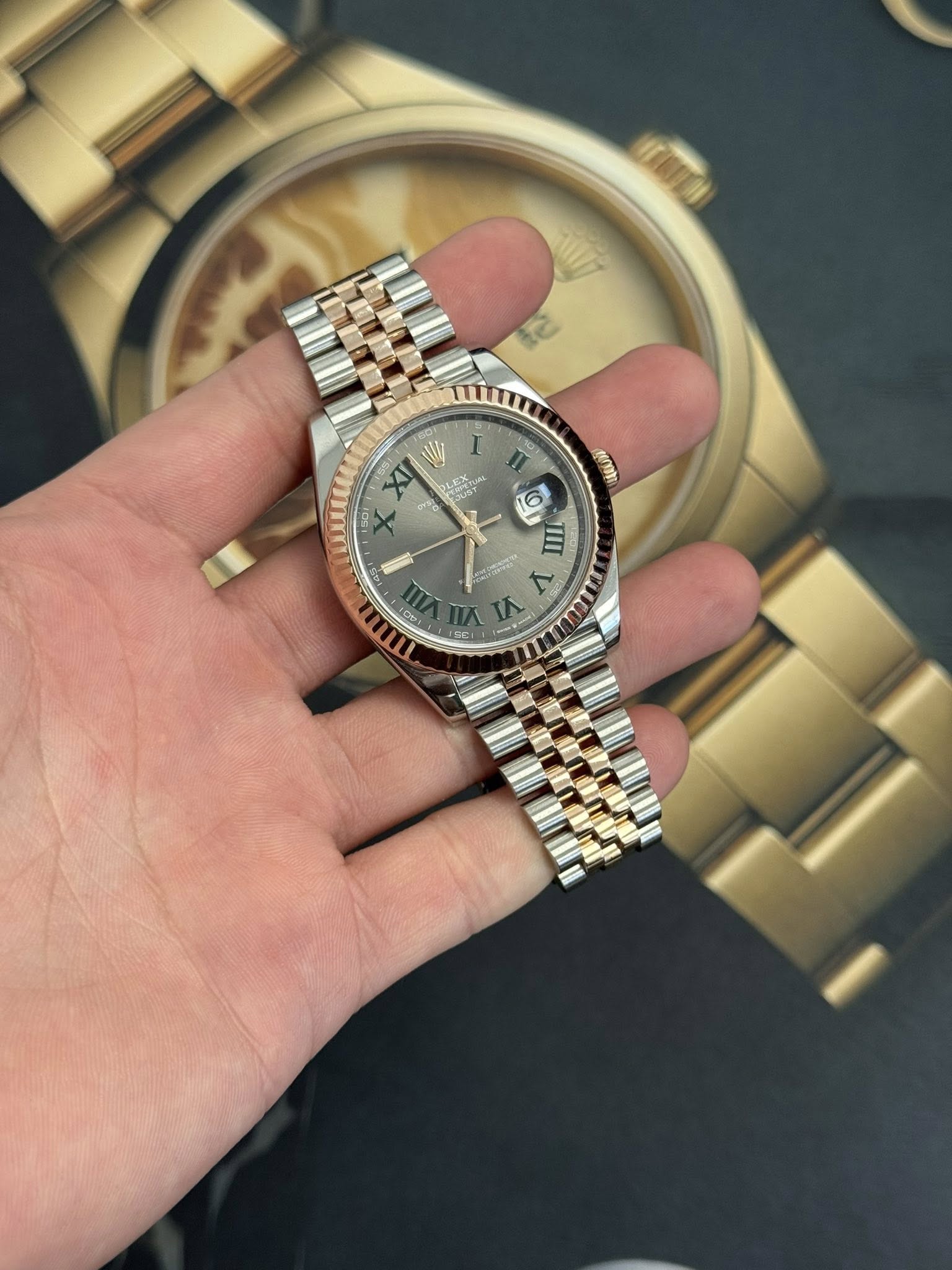 May be an image of wrist watch and text