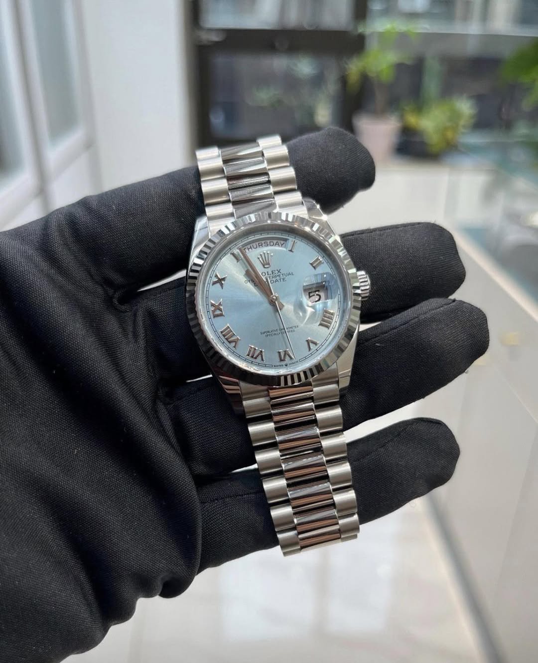 May be an image of wrist watch and text