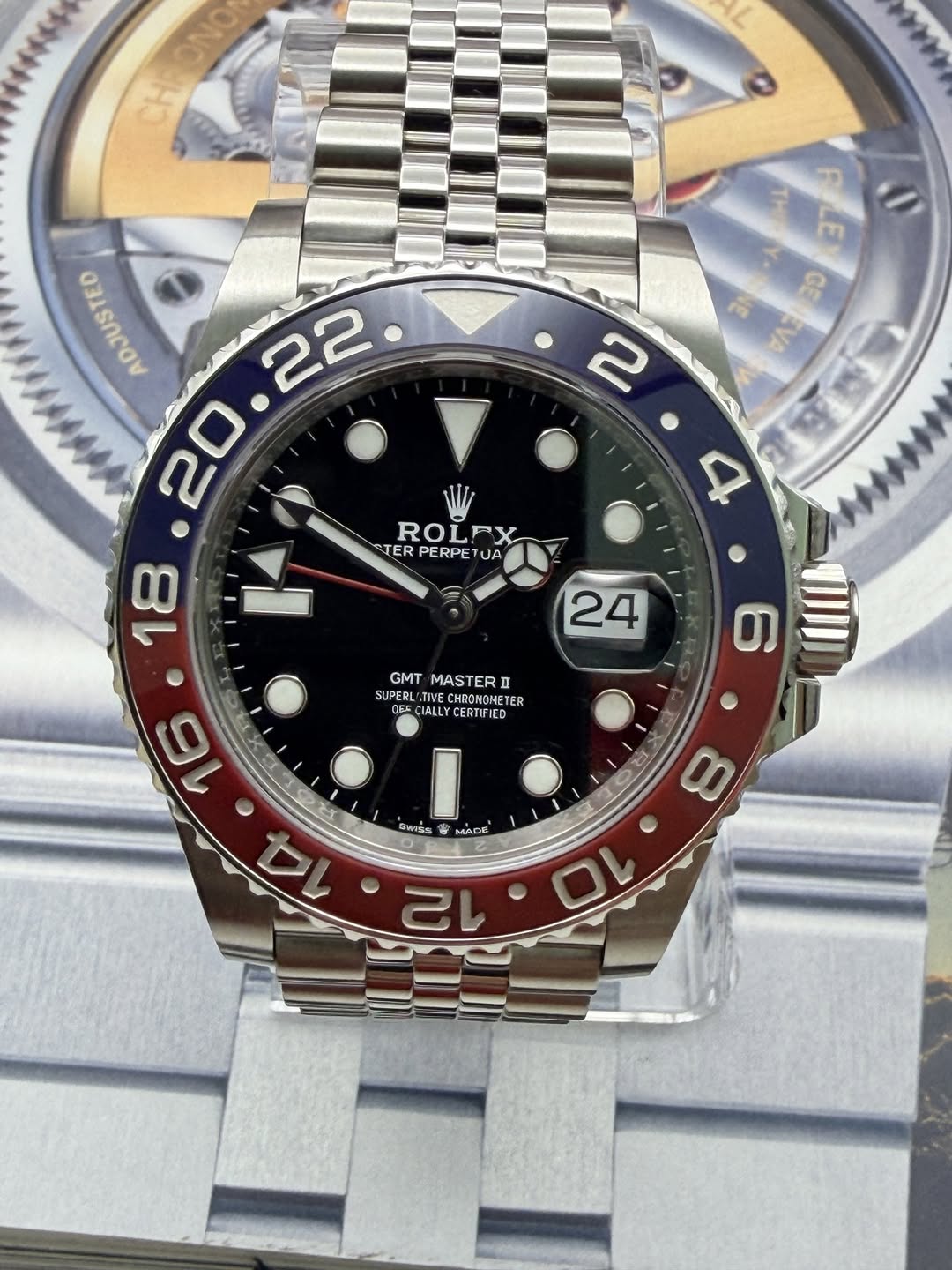 May be an image of wrist watch and text that says 'CHRONO ONO LE GE 2 ADJUSTED 22 20 18 ROL ROLEX RX TER PERPETUA PERPE UA 4 24 4 2 GMT MASTERD SUPER ASTER CHRONONETE CALL ALL…