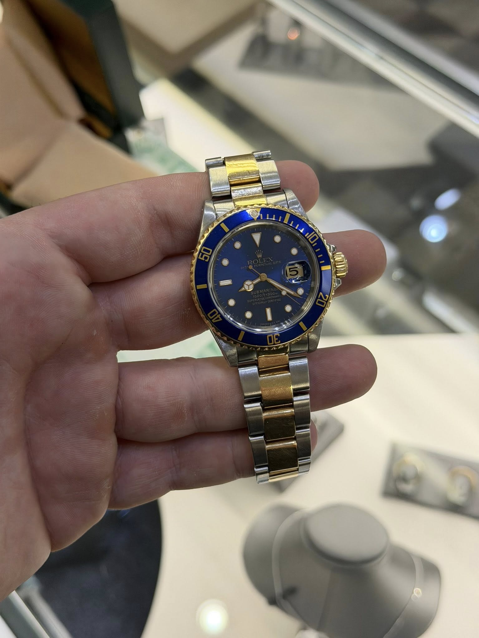 May be an image of wrist watch and text