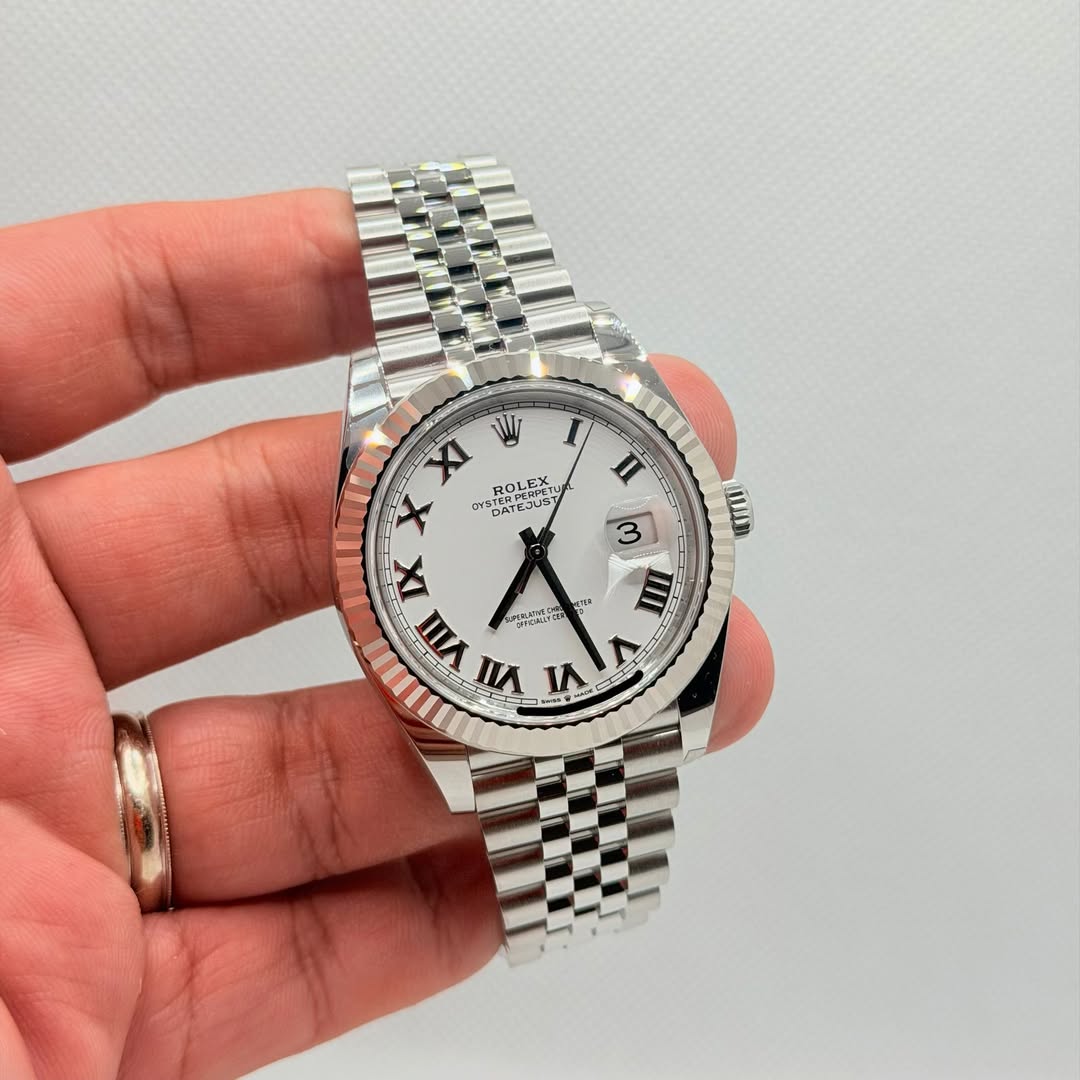 May be an image of wrist watch and text