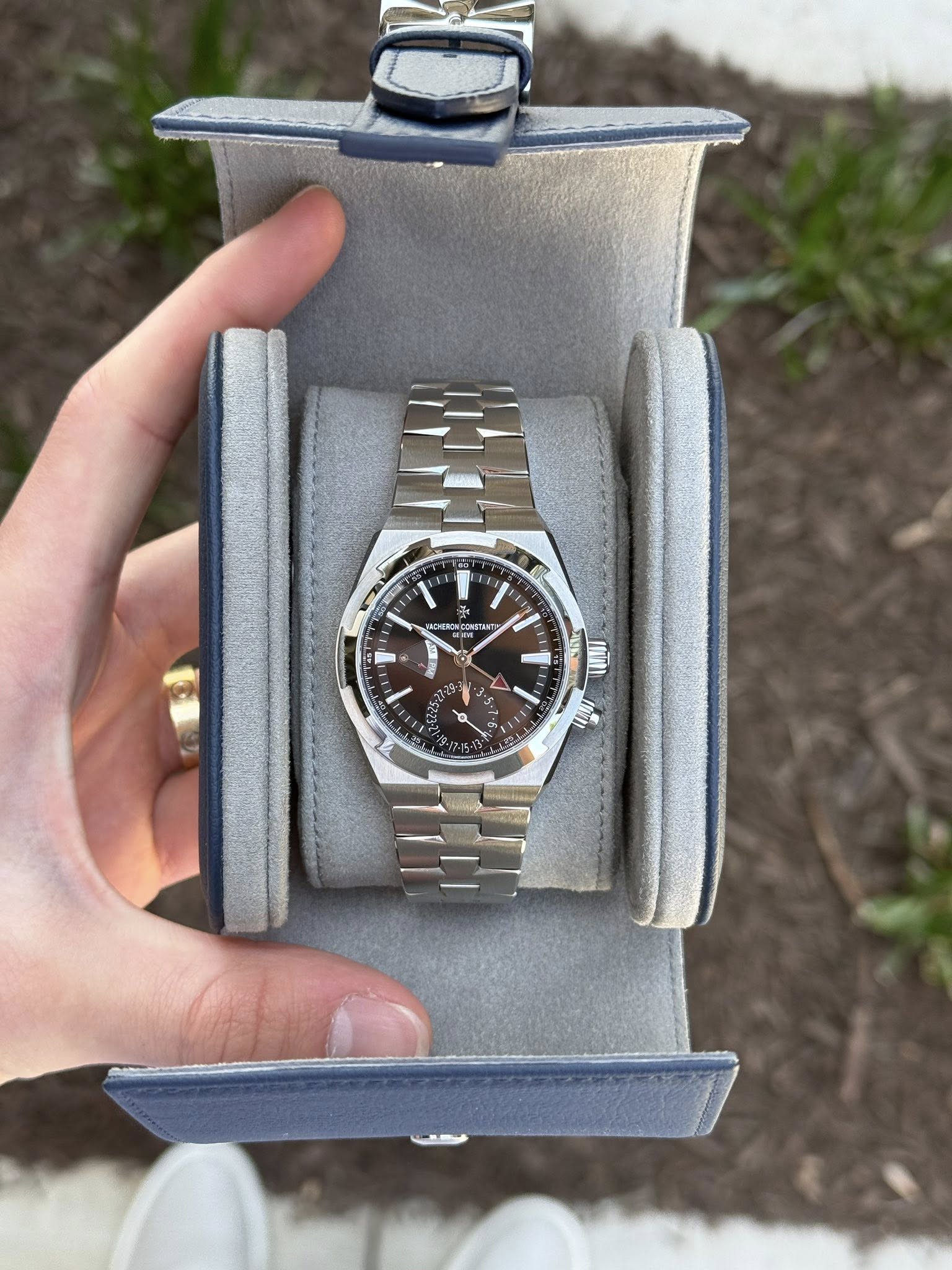 May be an image of wrist watch and text