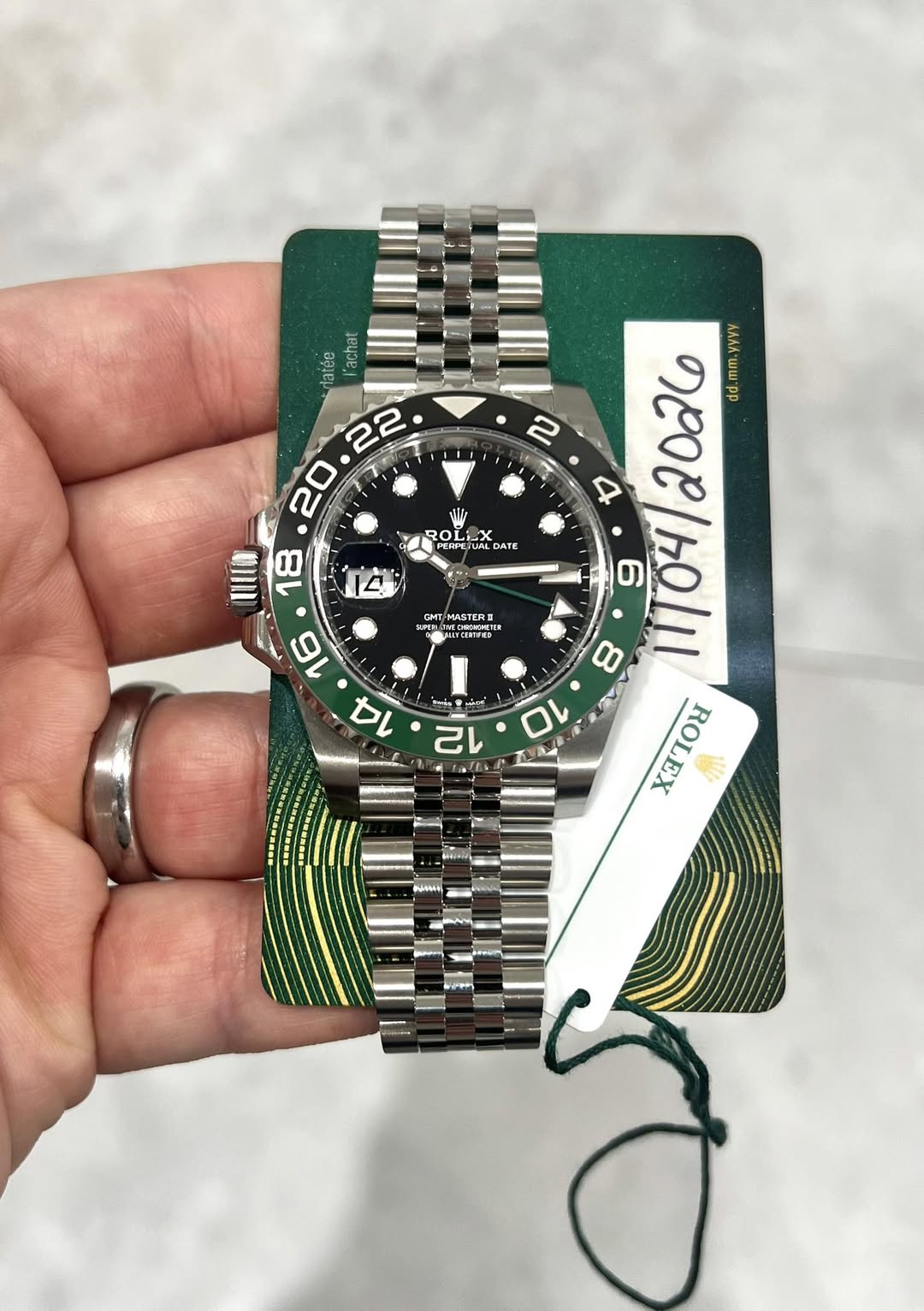May be an image of wrist watch and text