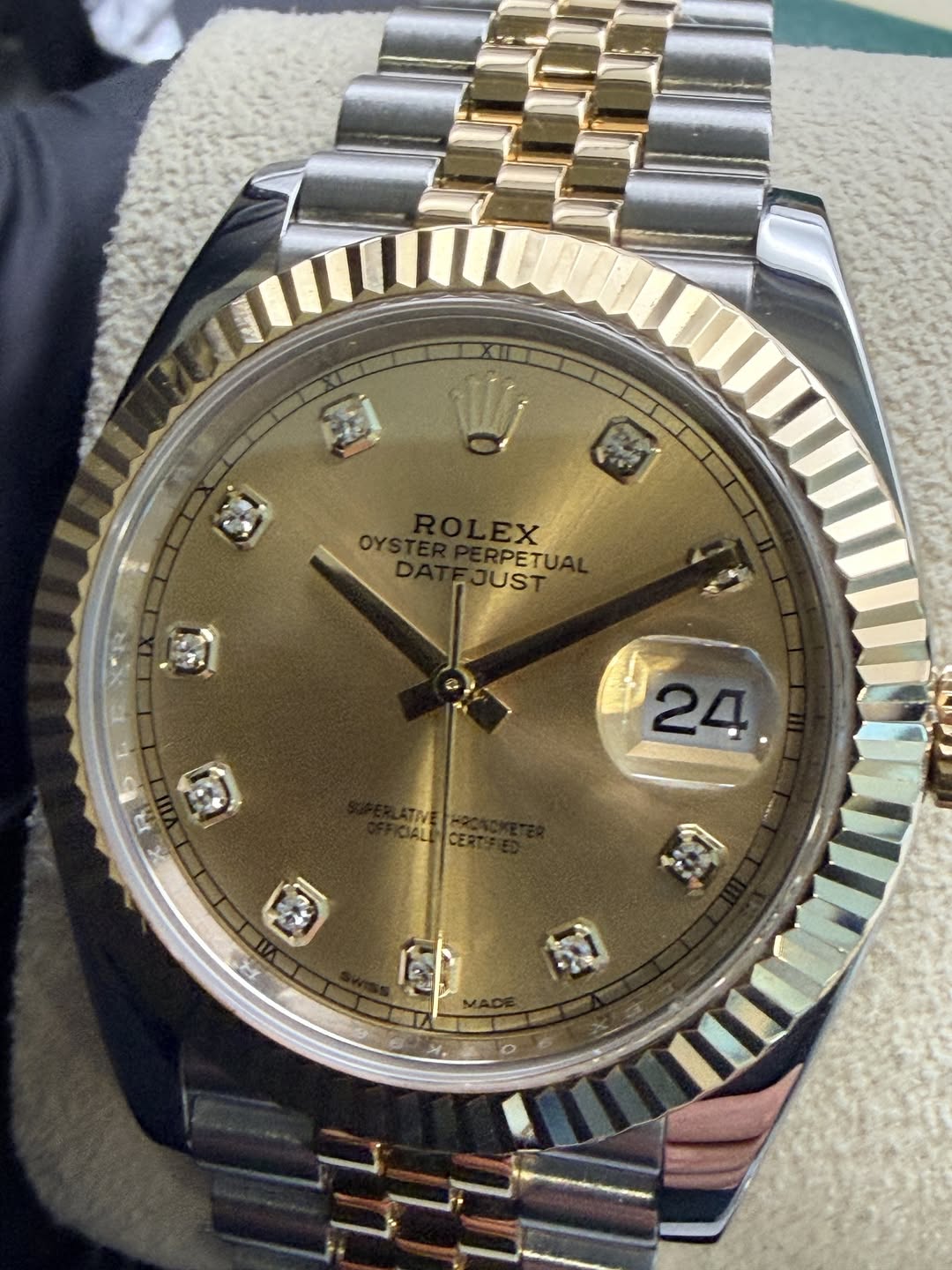 May be an image of wrist watch and text