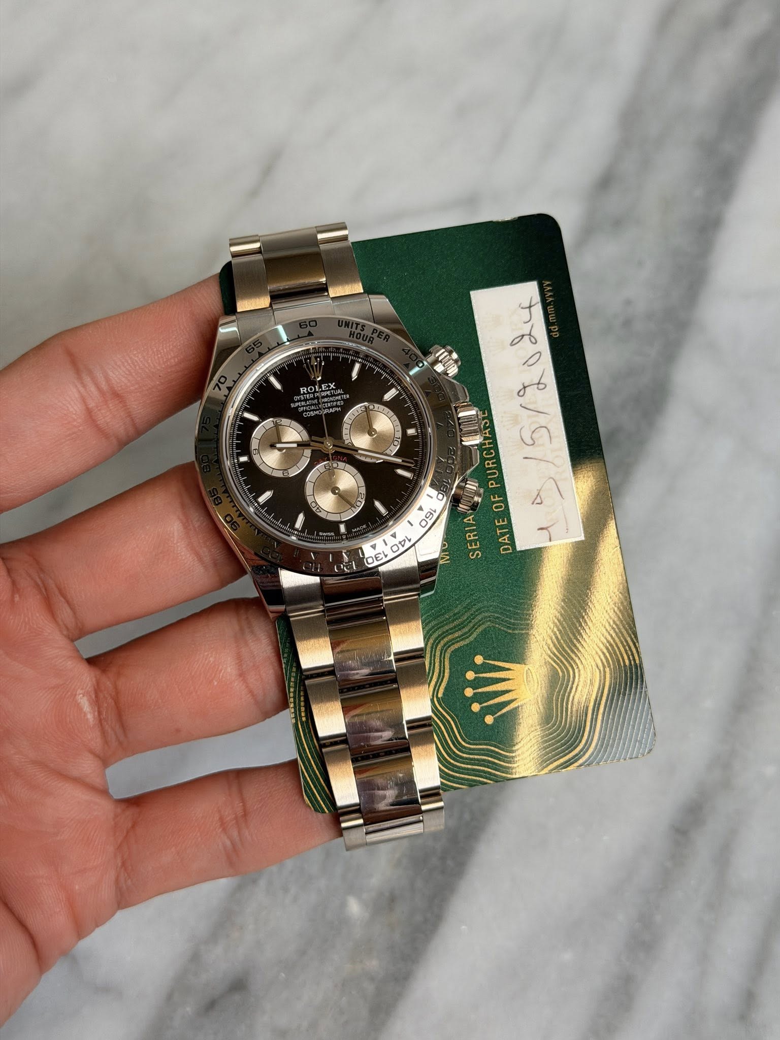 May be an image of wrist watch and text
