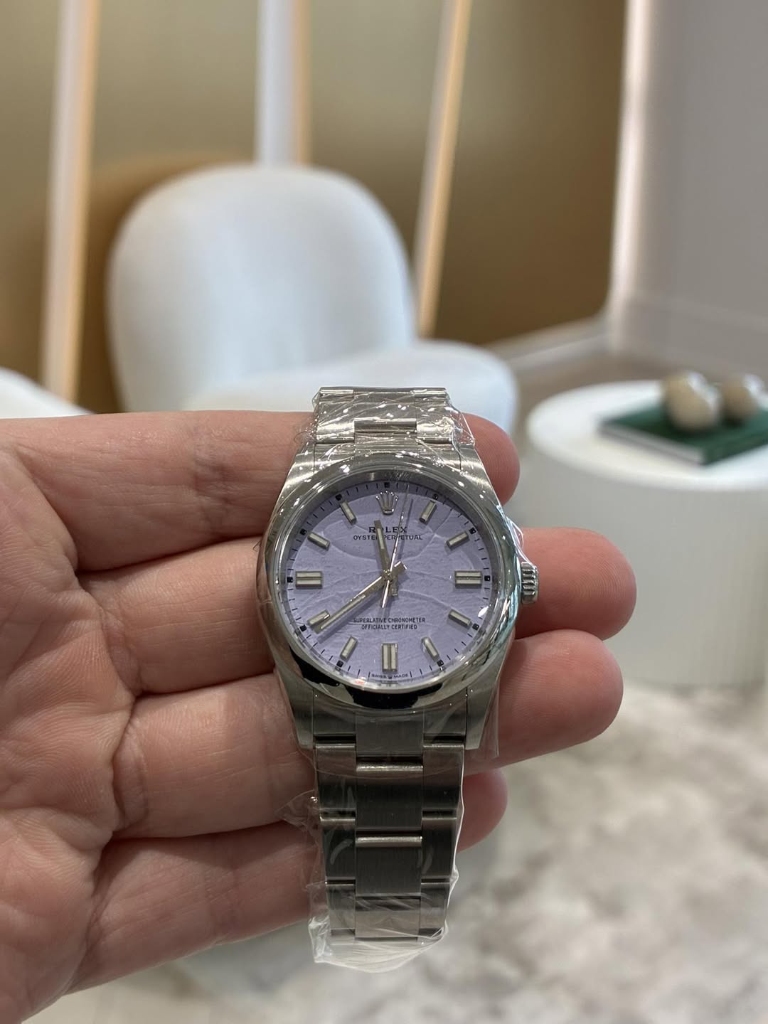 May be an image of wrist watch and text