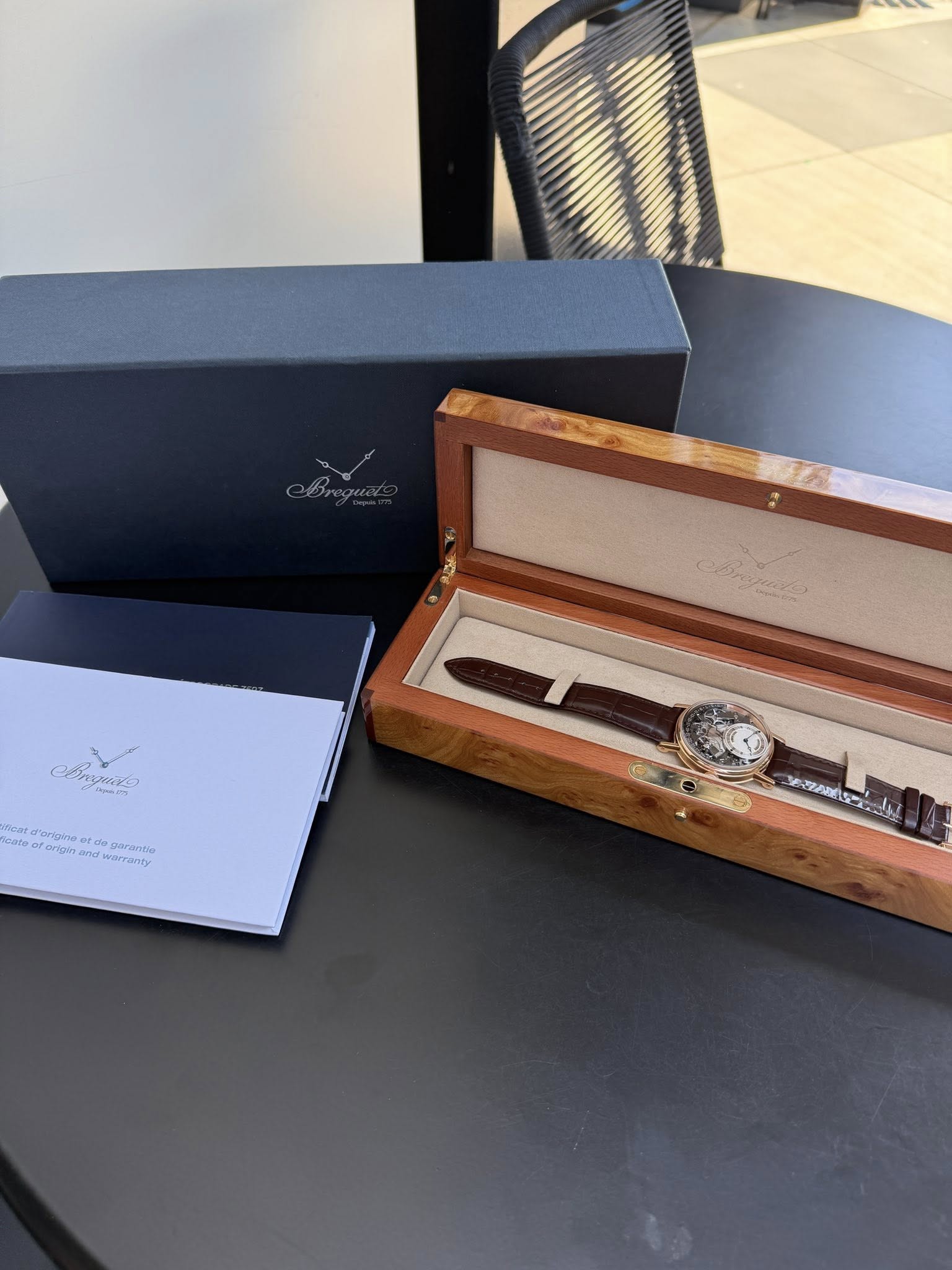 May be an image of wrist watch and text