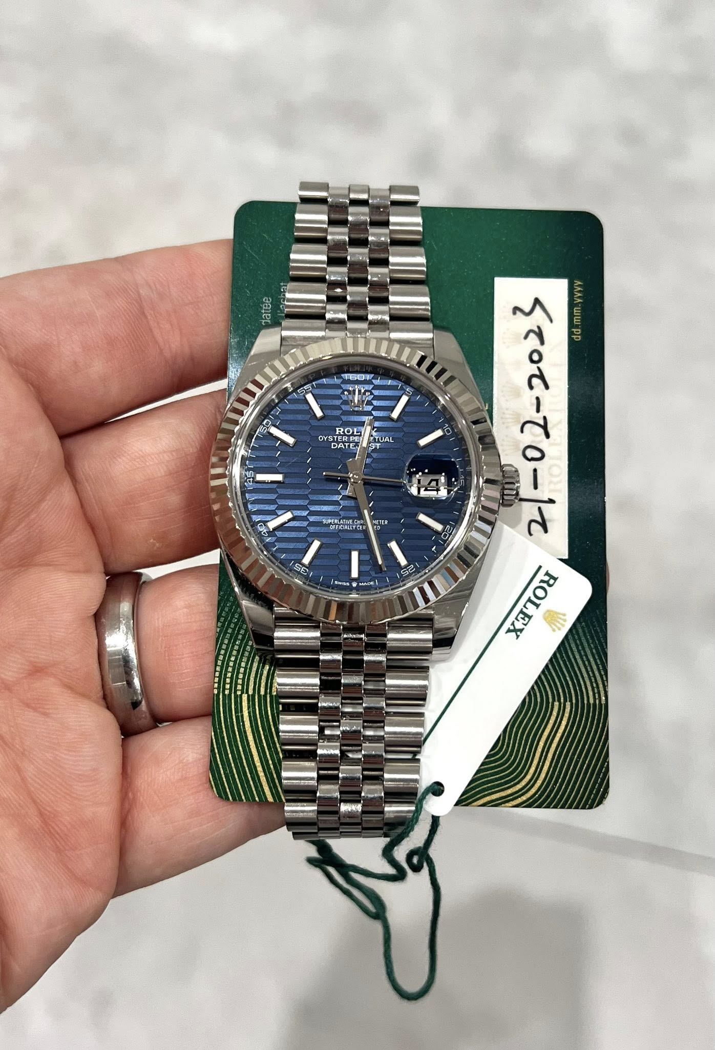 May be an image of wrist watch and text