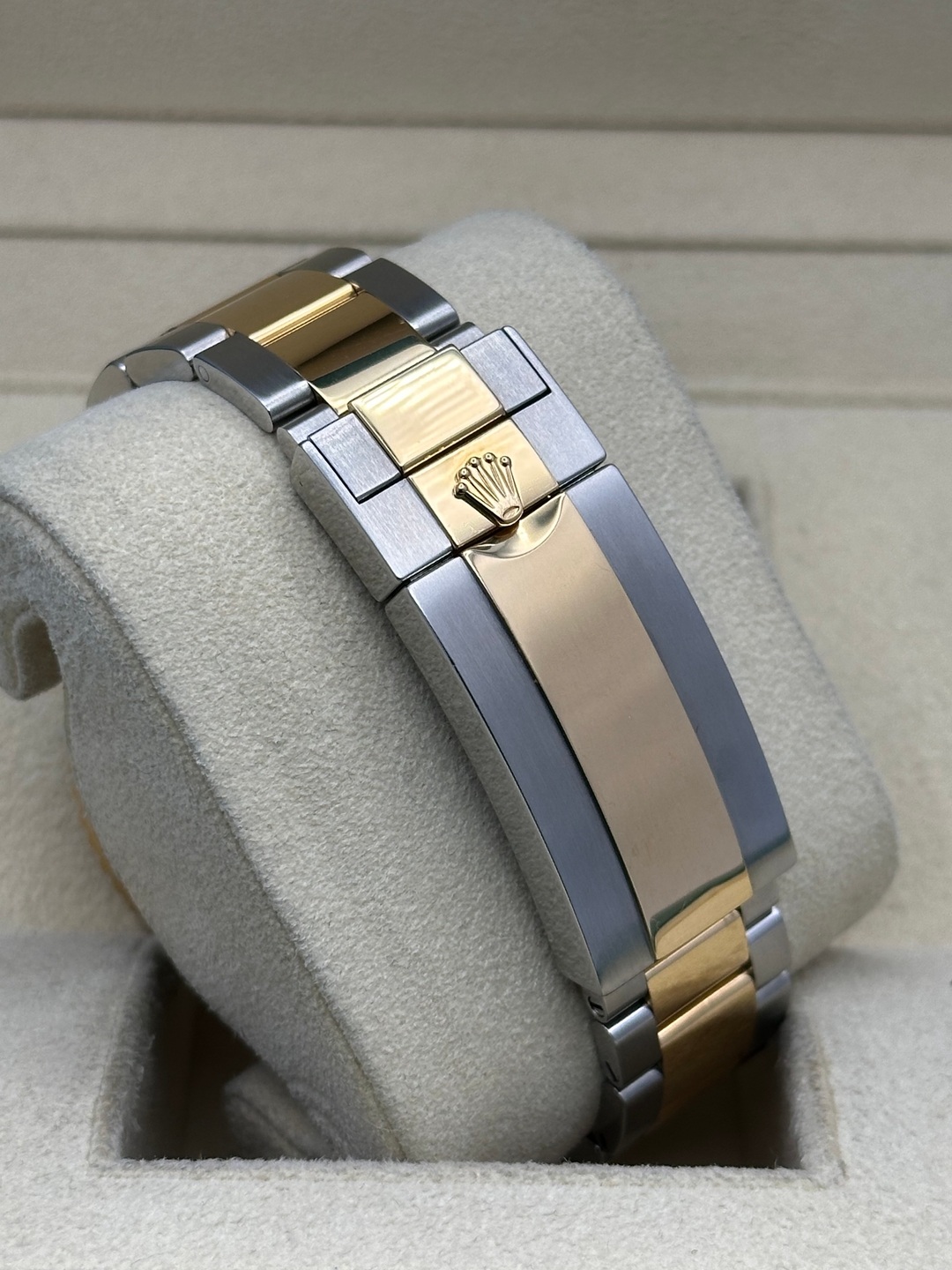 May be an image of jewelry, wrist watch and text