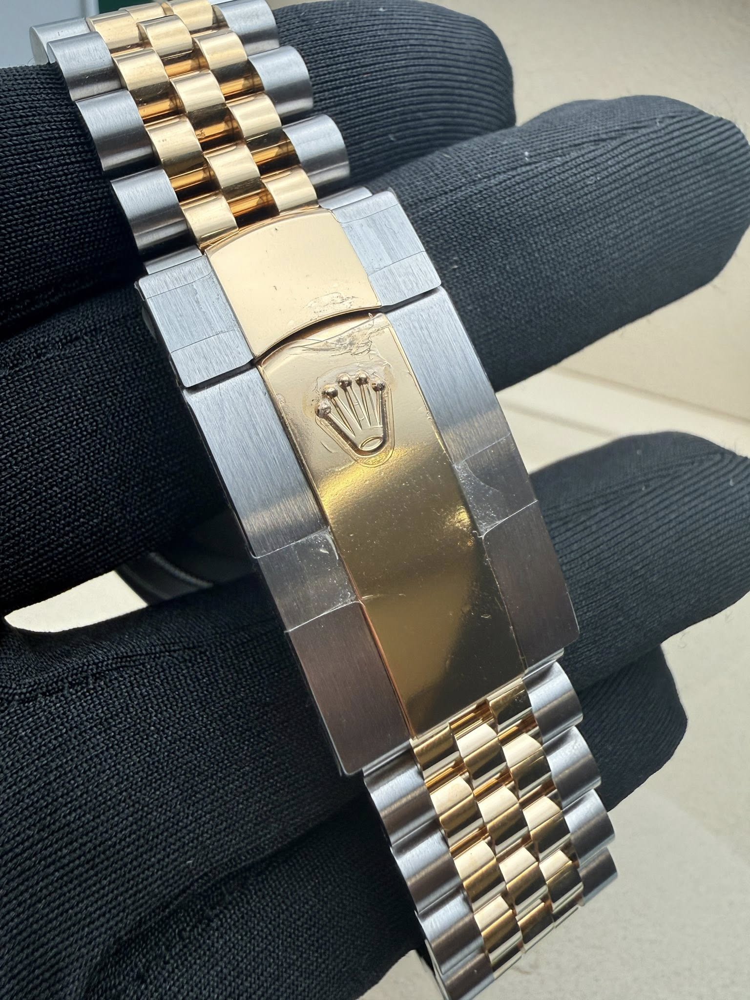 May be an image of wrist watch and text