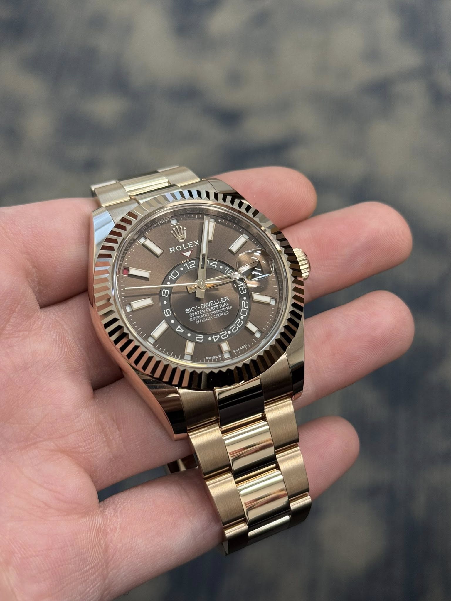 May be an image of wrist watch and text