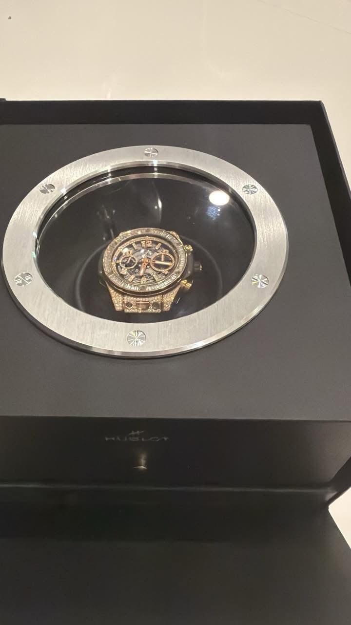 May be an image of wrist watch and text
