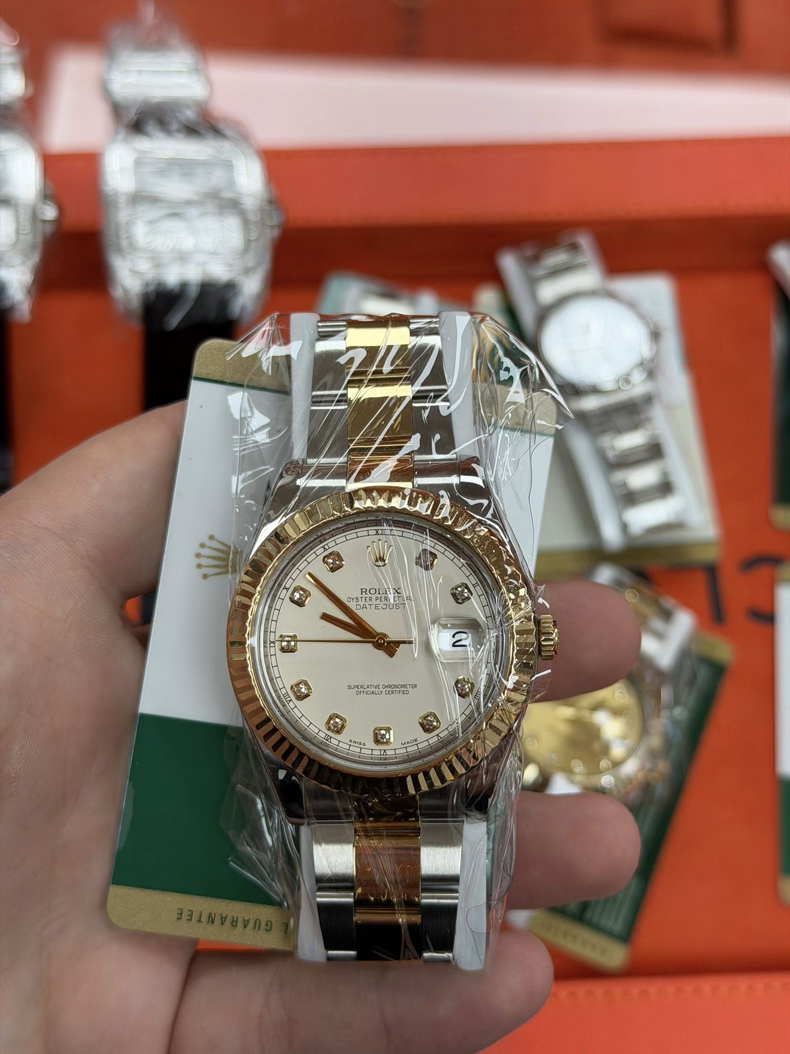 May be an image of wrist watch and text