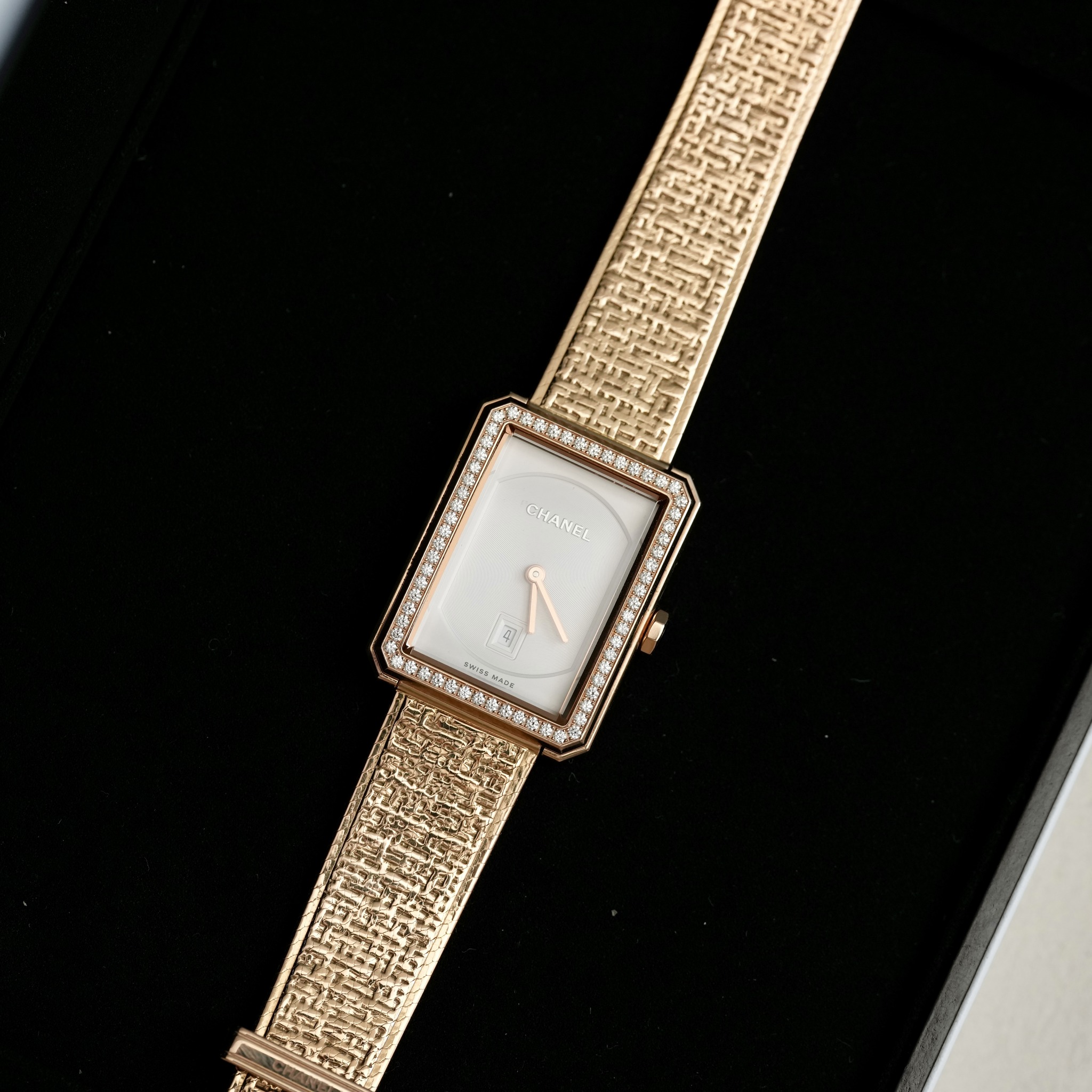 May be an image of wrist watch and text
