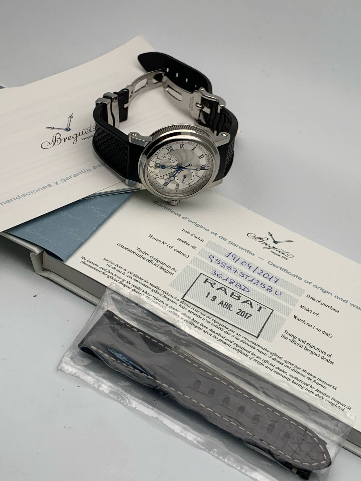 May be an image of wrist watch and text