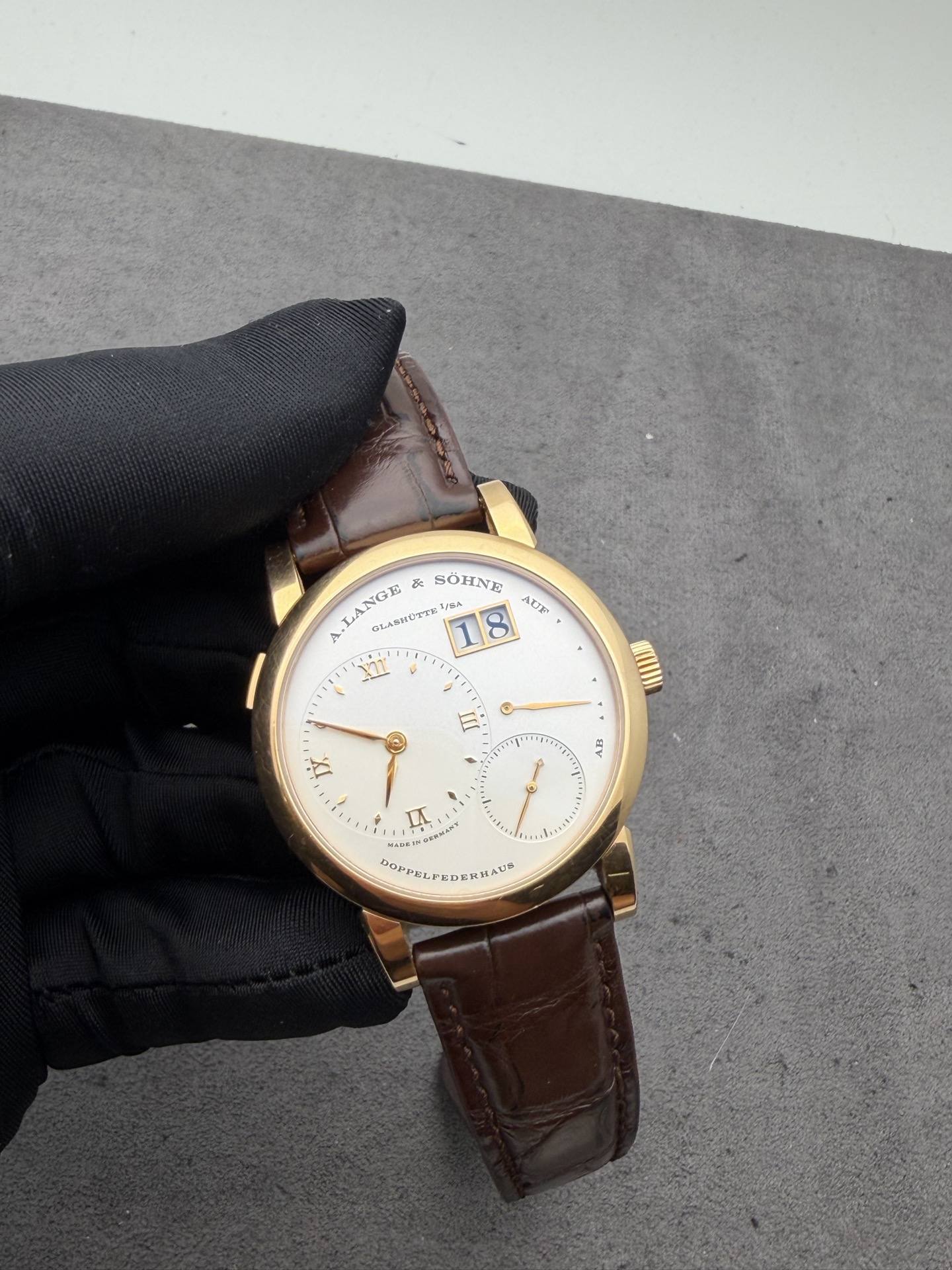 May be an image of wrist watch and text