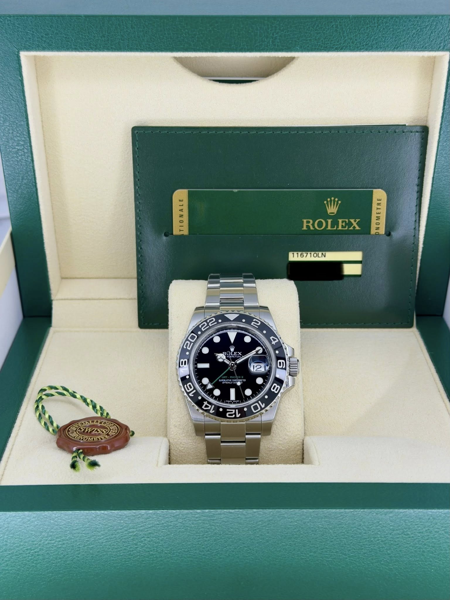 May be an image of wrist watch and text that says 'TIONALE ROLEX 生 116710LN EX X eA и 12 6 ซุร 8 16 14 ស 0'