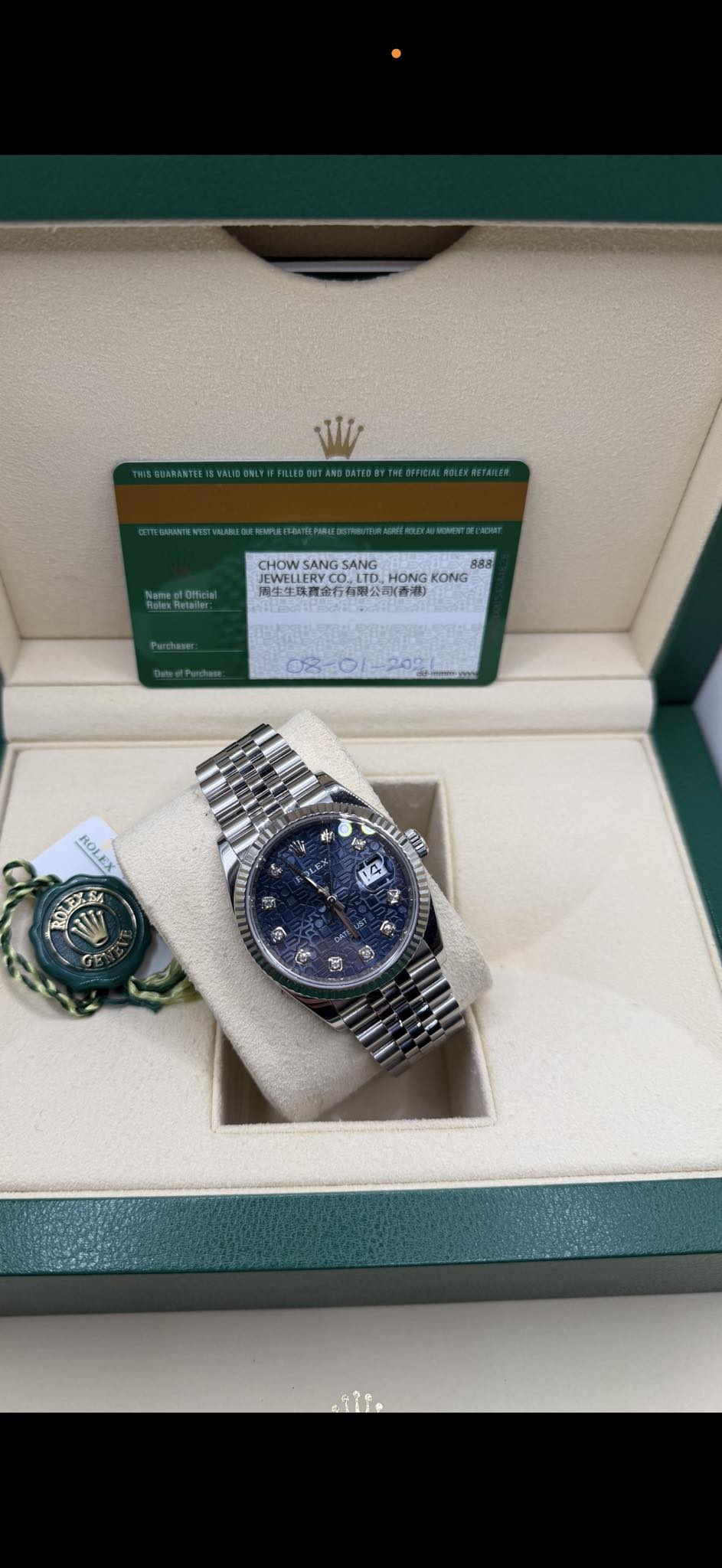 May be an image of wrist watch and text