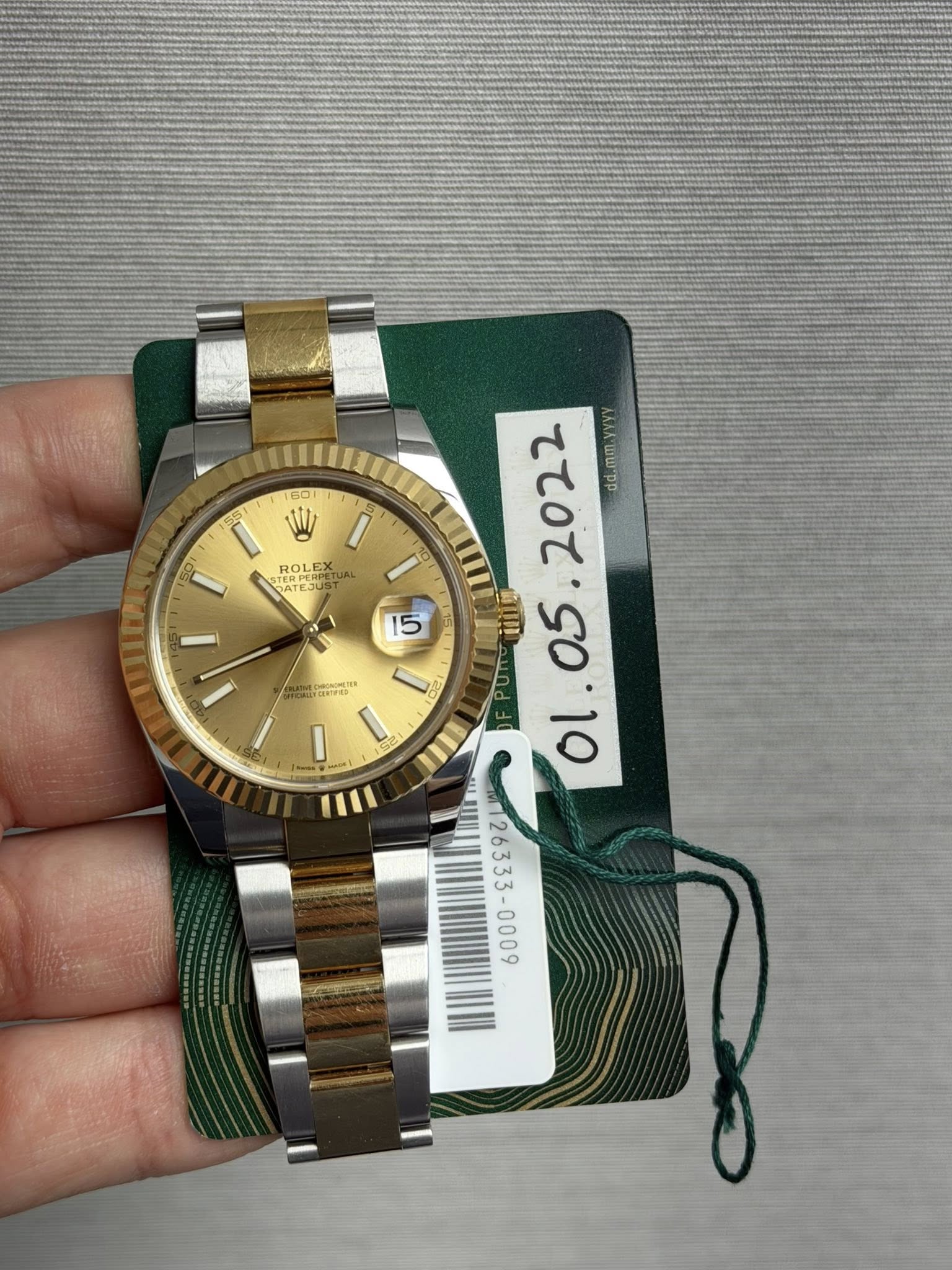 May be an image of wrist watch and text