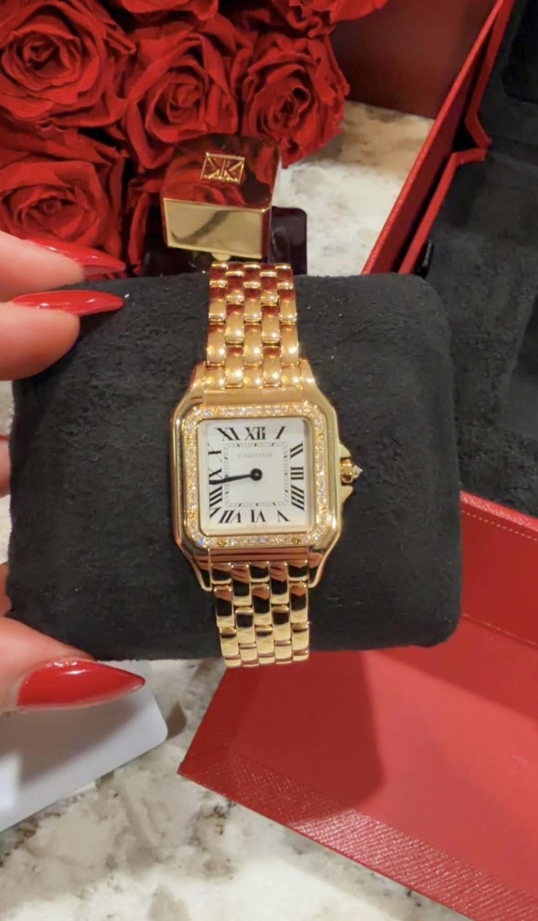May be an image of wrist watch and text