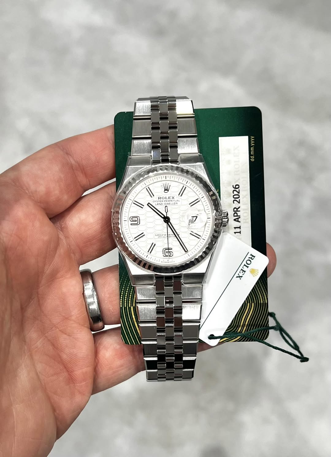 May be an image of wrist watch and text