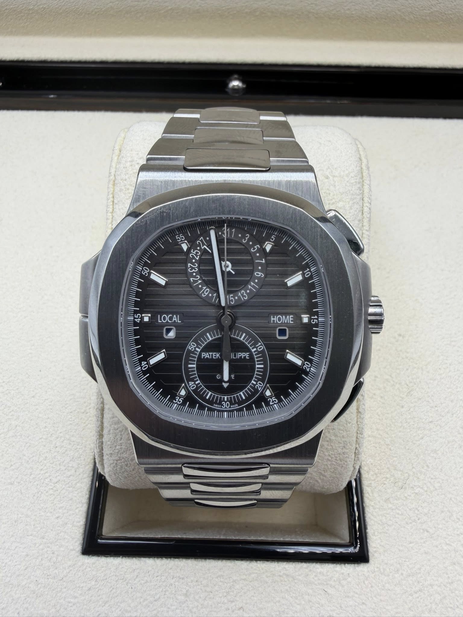 May be an image of wrist watch and text