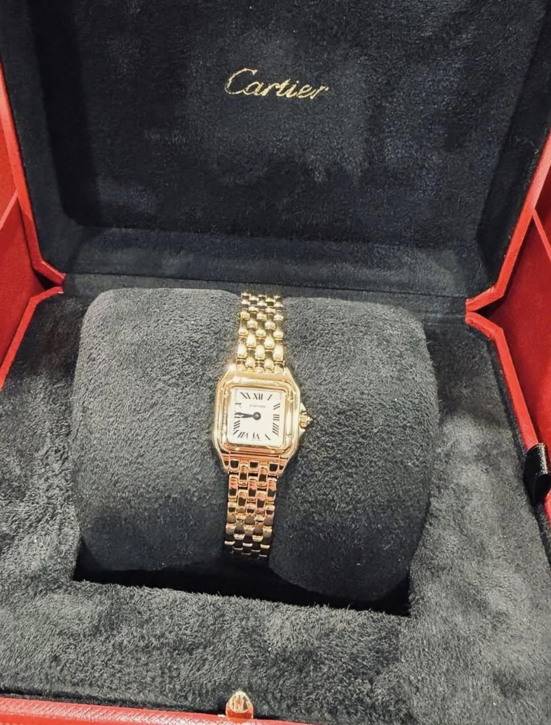 May be an image of wrist watch and text