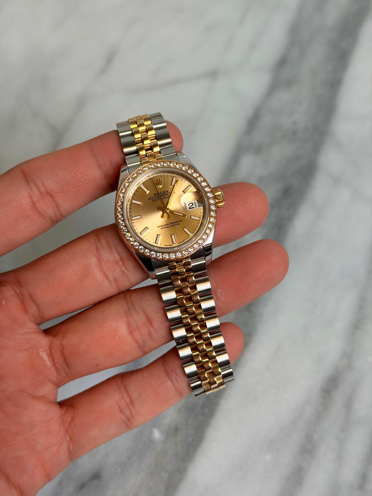 May be an image of wrist watch and text