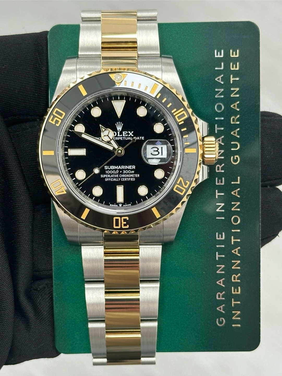 May be an image of wrist watch and text that says '50 S EX ERPETUAL QATE 31 SUBMARINER ம்் 1000ft 300m 300m RONOMET ETER OFFICIALLYCERTPIED 40 X สารื่ล MADE 30 4B 10 ATIONALE…