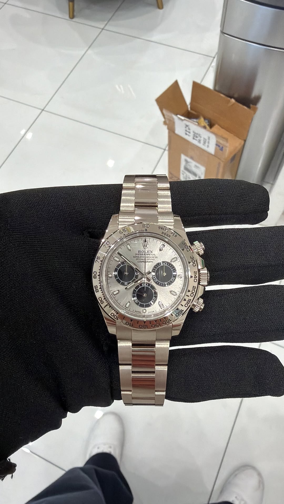 May be an image of wrist watch and text