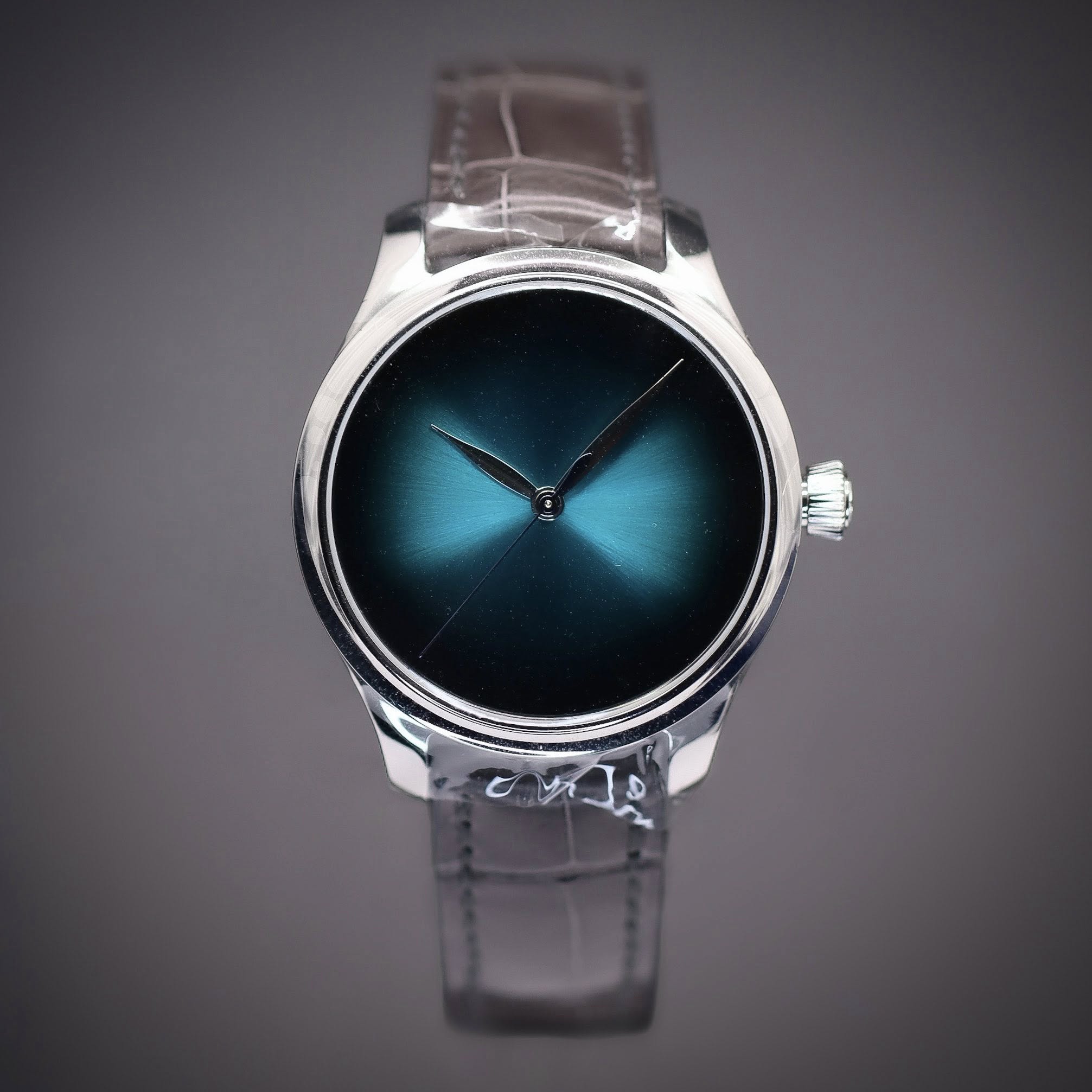 May be an image of wrist watch and text