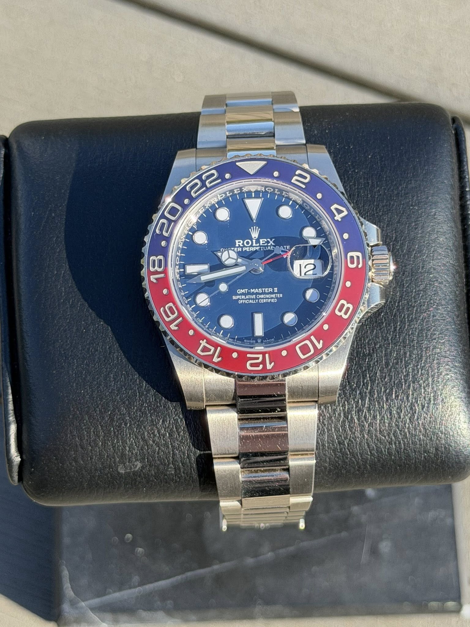 May be an image of wrist watch and text
