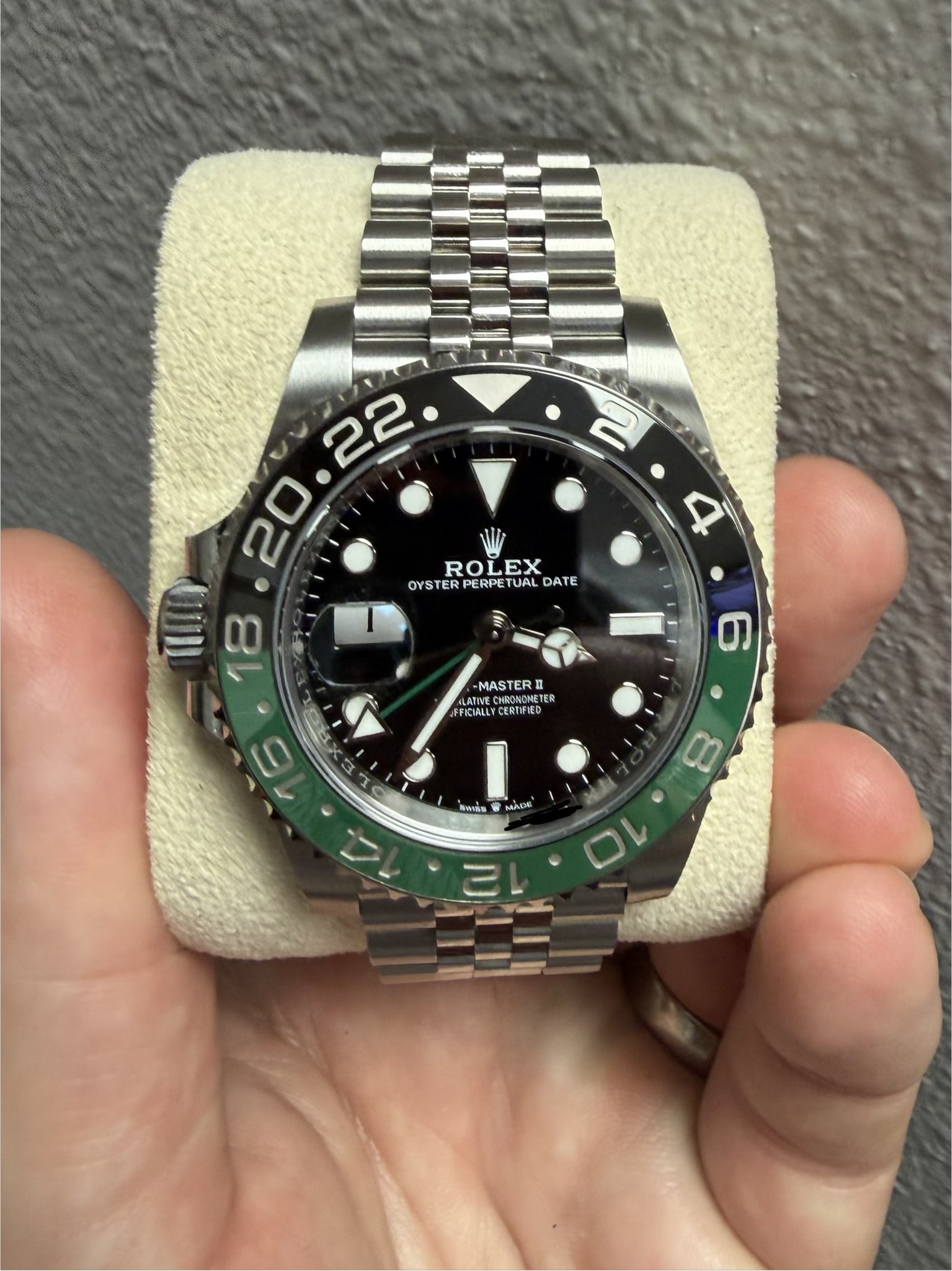 May be an image of wrist watch and text