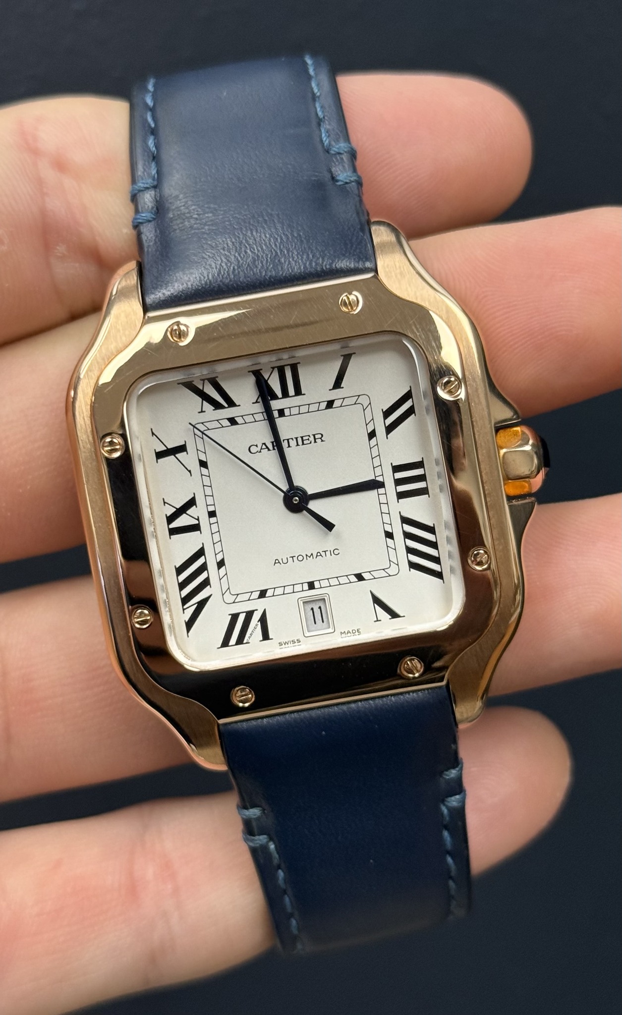 May be an image of wrist watch and text