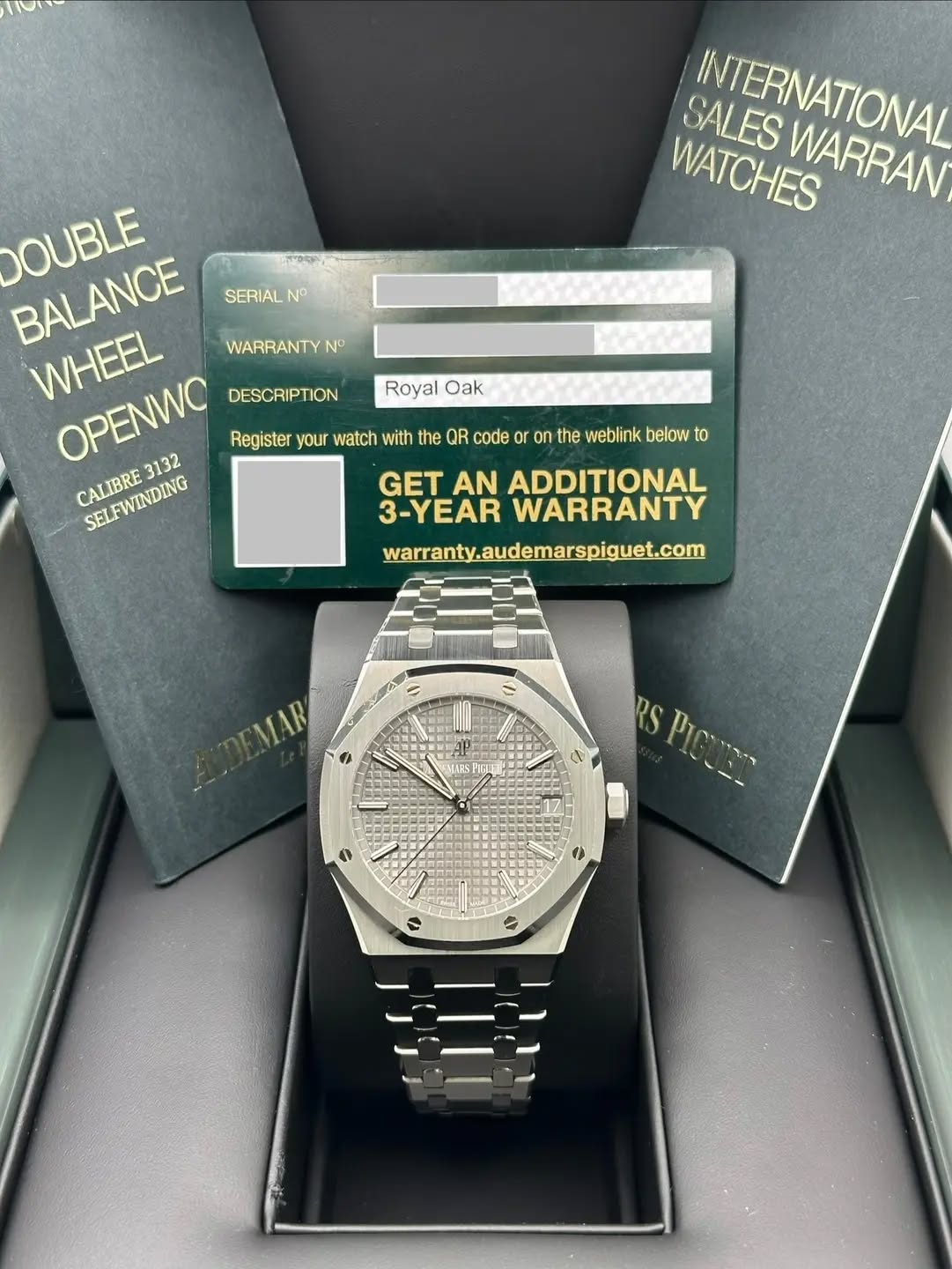 May be an image of digital watch and text that says 'SALES INTERNATIONAL WATCHES WARRAN Royal Oak DOUBLE BALANCE SERIAL NO WHEEL OPENWO 3132 WARRANTY N DESCRIPTION Register your…